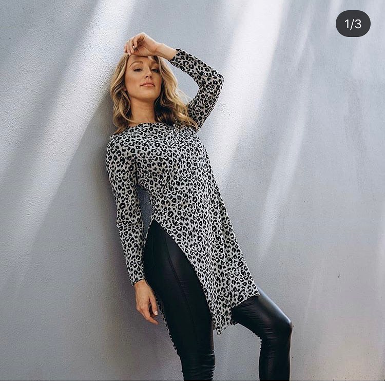 woman posing in leopard print shirt